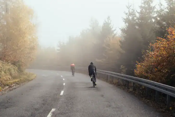 cycling-david-dvoracek-ksTYdibV284-unsplash Cycling on a road through woods